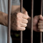 Hands of the prisoner in jail